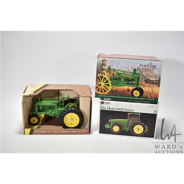 Three collectible farm toys including 1:16 scale Ertl John Deere model "G" tractor, 1:32 scale John 