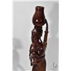 Image 2 : Two carved wooden figures including woman w/ two children measuring 23" high and woman w/ basket mea