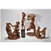 Image 1 : Four carved wooden figures including 16" man w/ sack, 11" man & woman, 8" two children and 17" tall 
