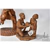 Image 3 : Four carved wooden figures including 16" man w/ sack, 11" man & woman, 8" two children and 17" tall 
