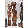 Image 3 : Four carved wooden figures including 20" man w/ club, 16" woman w/ basket, 15" woman w/ child and 10