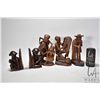 Image 1 : Four carved wooden figures including 6" bookends, 10" woman w/ cane, 10" parents w/ child and 9" man