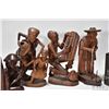 Image 3 : Four carved wooden figures including 6" bookends, 10" woman w/ cane, 10" parents w/ child and 9" man