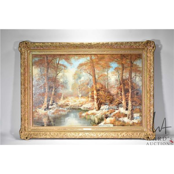 Gilt framed oil on canvas painting of a forest creek scene. Signed by artist "H.L Scheffel". Measuri