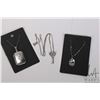 Image 1 : Three pieces of sterling silver jewellery including 16" necklace with key pendant, helmet pendant on