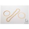 Image 1 : Ivory bangle, bone like/ marine ivory bangle and a beaded bracelet
