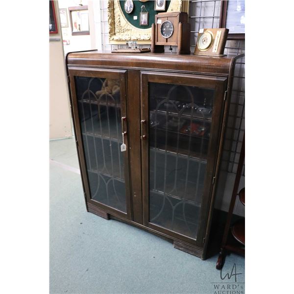 Art Deco waterfall style, two door, curio/ display cabinet with original pulls, 48" X 39" X 12"