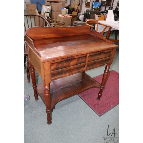 Mid 1800's two drawer mahogany washstand with low backboard and turned supports, 36" X 33" X 18"