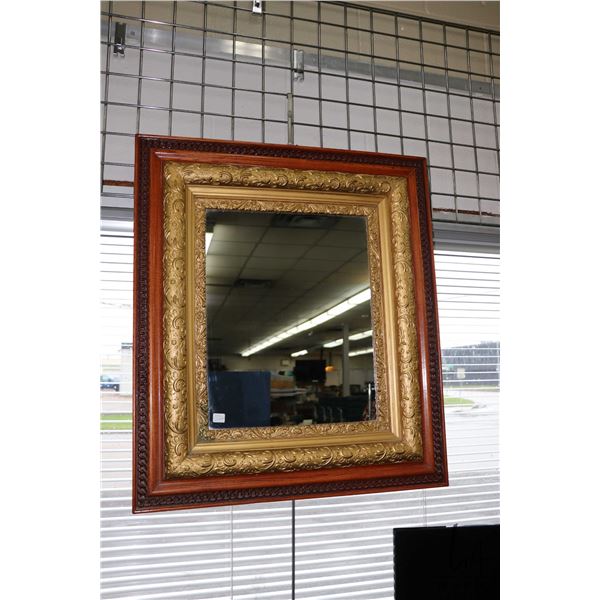 Antique wood and gilt framed wall mirror, outside dimensions, 32" X 28". NOTE: This Lot Is Not Avail