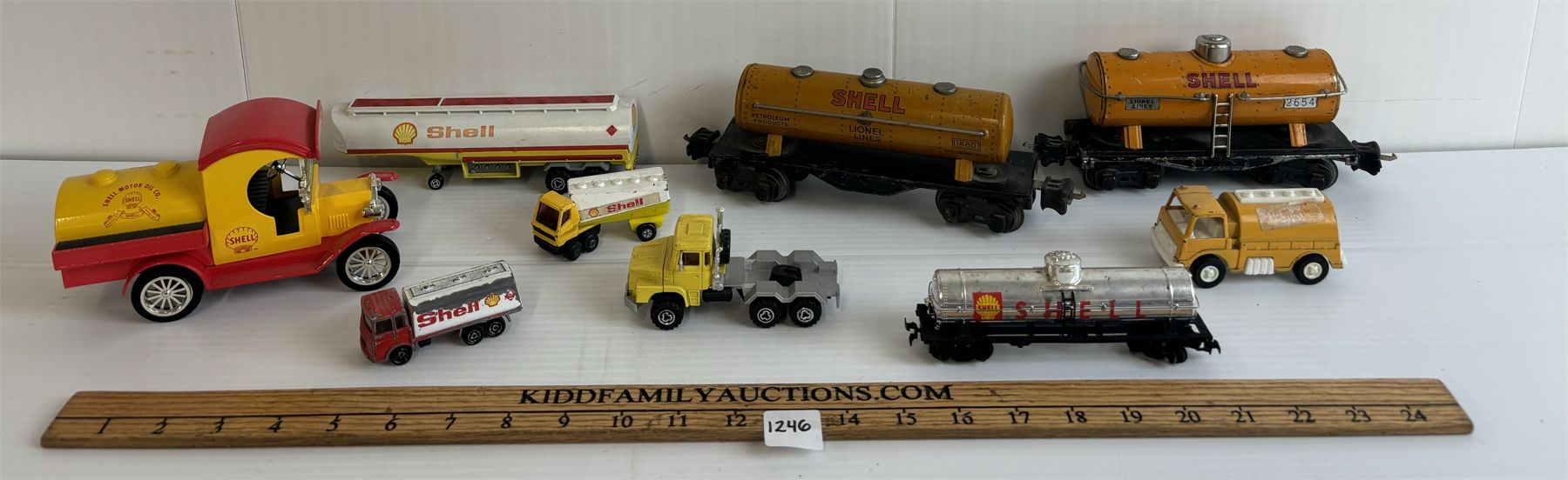 LOT OF 10 - SHELL TRAINS, TRUCKS & CAR BANK - INCL LIONEL LINES, ETC.