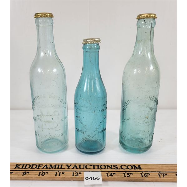 LOT OF 3 - EMBOSSED BOTTLES - INCL SASKATOON MFG CO., BRANDON BREWING CO., ETC.