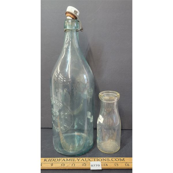 LOT OF 2 - EMBOSSED BOTTLES - INCL MAPLE DAIRY & HUDOR WATER CO.