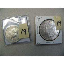 Lot of 2: 1893 u. Columbian Expedition half dollar; 1882 O b. u. Morgan dollar (3)