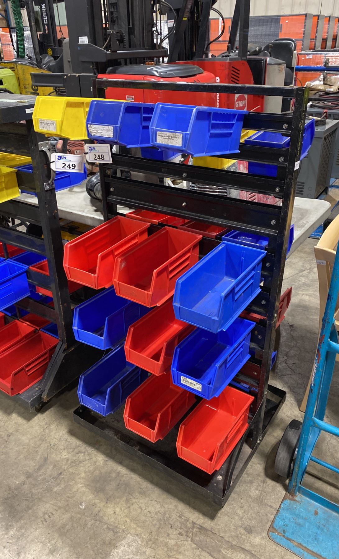 BLACK METAL MOBILE INDUSTRIAL PARTS RACK WITH ASSORTED PLASTIC PART ...