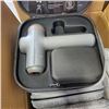 Image 2 : 7 SHARPER IMAGE MASSAGE GUNS IN HARD CASE - NO POWER SUPPLIES, SOME FOR PARTS ONLY, UNTESTED