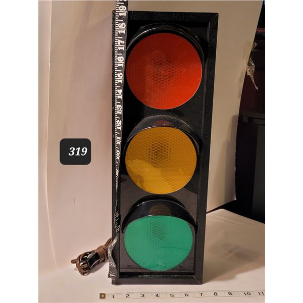 Electric, colour changing stop light. Made in Canada.