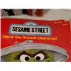 Image 2 : Late century Sesame Street books & rug hooked Oscar the grouch.