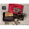 Image 1 : Vintage sewing machine accessories with a small musical replica.