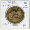 Image 1 : 1969 Whitehorse, Yukon Trade Dollar. Airplane at top. YT-2B. BU.