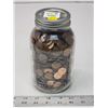 Image 1 : Mason jar filled with Canadian/US pennies