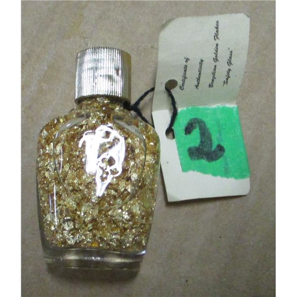 BOTTLE C/W GOLD COLORED FLAKES