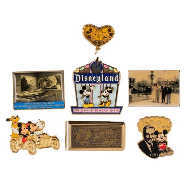 A Collection of Disneyland Pins and a Money Clip.