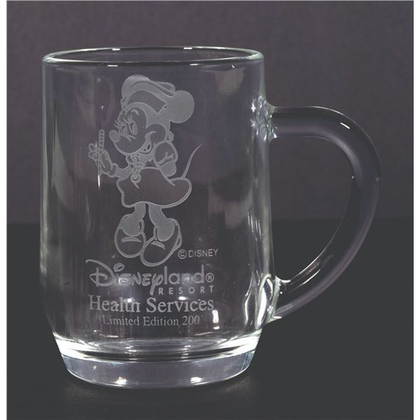 A Cast Member Health Services Glass Mug.