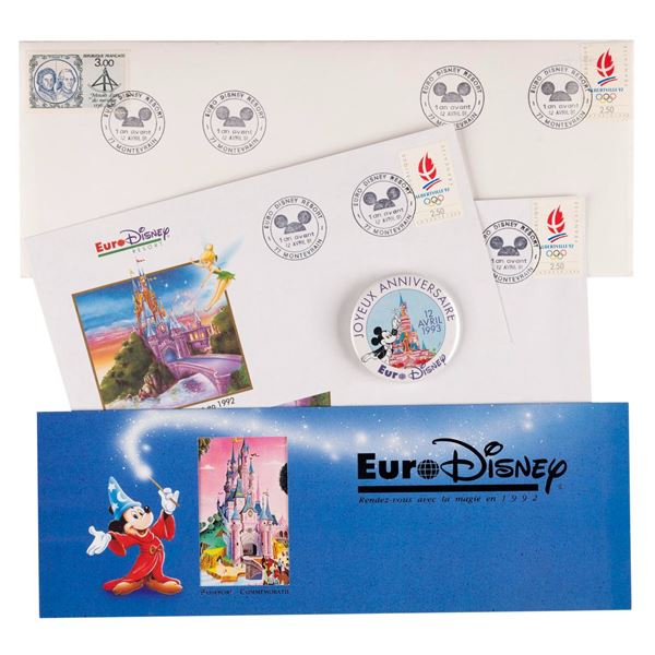 A Euro Disneyland Commemorative Passport and Button.