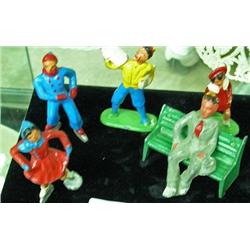 Five Lead Figures - 2 Skaters, Paper Boy, Girl With Bear, Man Sitting On Bench ( Possible Barclay)