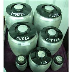 Five Piece Chrome Canister Set With Black Lids And Salt & Pepper Set