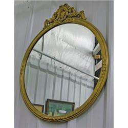Round Gilt Framed Mirror With Applied Carvings