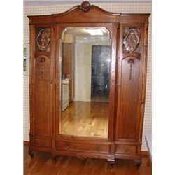 3 Door Oak Armoire With Beveled Mirrored Center Door And Lead Glass Panels In Side Doors