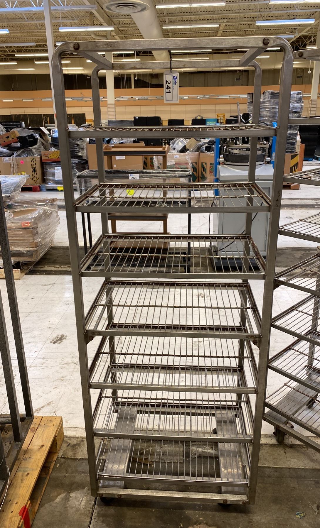 7 TIER STEEL MOBILE COMMERCIAL MESH DECK PRODUCT RACK - Able Auctions