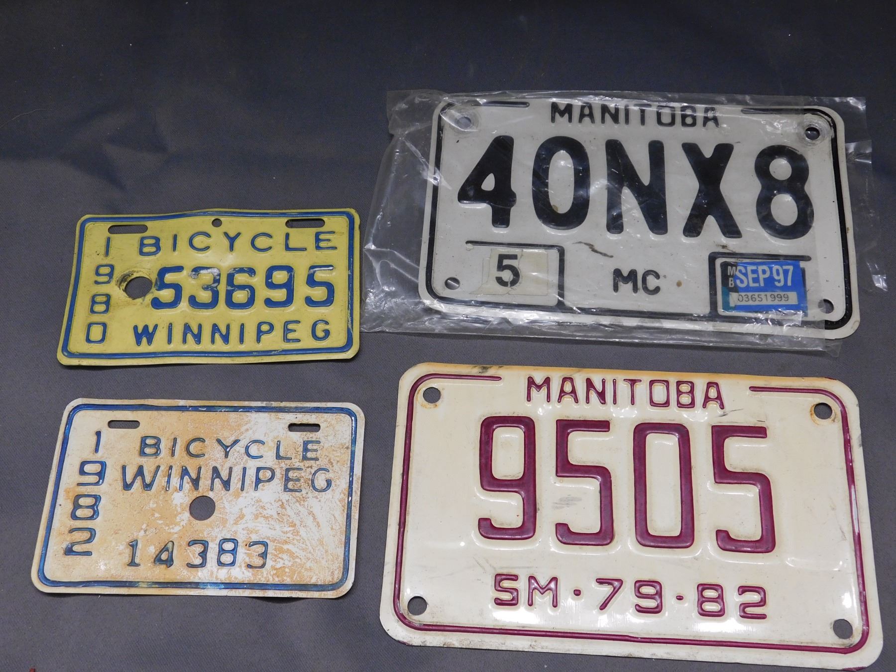 Lot of 2 Manitoba Motorcycle License Plates & 2 Winnipeg Bicycle Plates