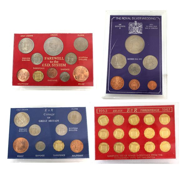 Lot of Great Britain Coin Sets in Hard Plastic Holders. 4 sets