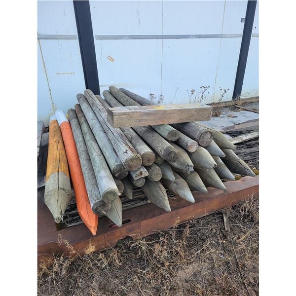 Approx. 30 sharpened wood posts
