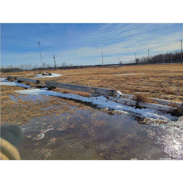 (Lots 273, 275 to 279 are a Group Lot) 2- Long power poles c/w 4 shorter ones underneath