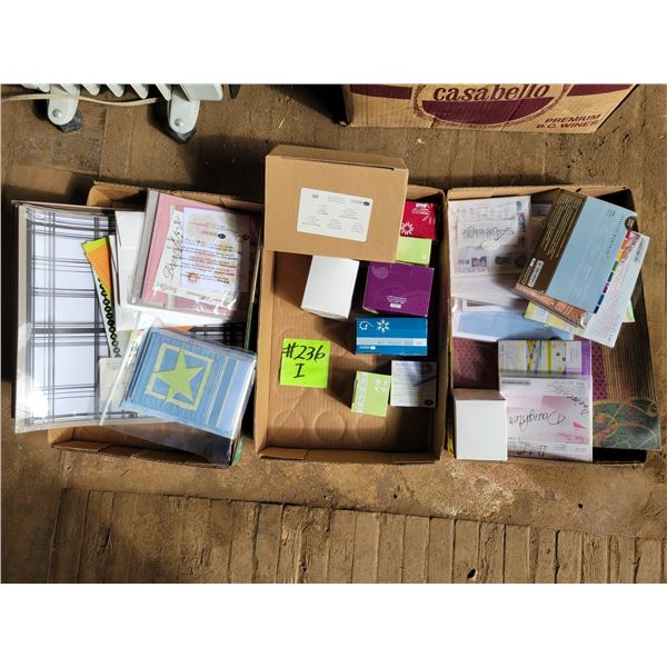 3- boxes of scrapbook paper photo matts, punches etc.