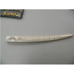 27" white ivory cribbage board scrimshawed with 2 fish done by Gloria Kuskawiyi from Savoonga, Alask
