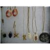 Image 2 : Lot of: scrimshawed baleen pendant, scrimshawed ivory pendant, carved ivory owl pendant, gold nugget