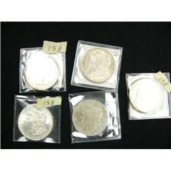 Lot of 5 silver dollars- two 1886 brilliant unc. made in Phil., 1887 brill. unc. from Phil., 1897 fr