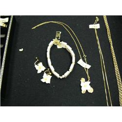 Lot of: beautiful ivory bracelet, an ivory floral pendant with gold nugget center, pair of gold nugg