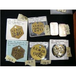 Lot of: 5 brass tool tags from the Gastineau Mining Co. and two 1 oz. silver bars (3)