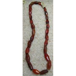 27" strand of faceted amber and argot trade beads (3)