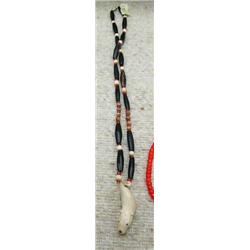 Ivory and red heart and buffalo horn bead necklace with ivory bear carved pendant with inset baleens