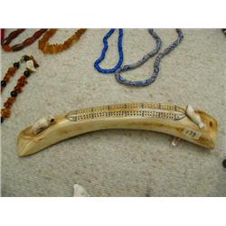 12" fossilized ivory cribbage board by Romeo Katexac from Nome, Alaska ca. 1970 with walrus and seal