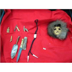 Collection consisting of: Anaktuvuk Pass mask, billiken ivory bolo tie, baleen and whale bone letter