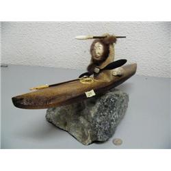 Kayaker/hunter in kayak mounted on soapstone- 17" and 9-3/4" tall