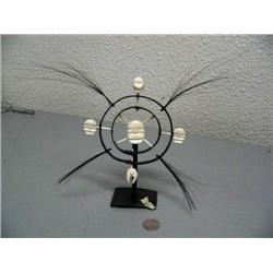 8" tall King Island masks mounted on baleen by Mark Seeganna