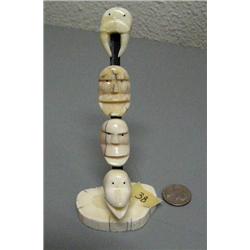 Set of 4 King Island masks carved from ivory mounted on ivory done by Mark Seeganna- 5-1/2" tall